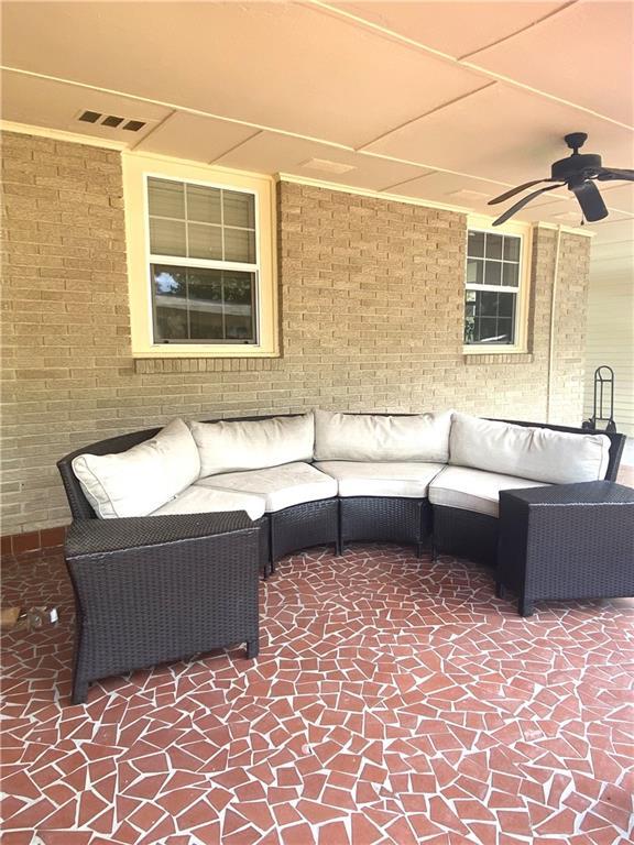 view of patio / terrace featuring visible vents, ceiling fan, and an outdoor hangout area