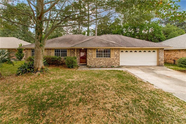 single story home featuring a garage and a front yard