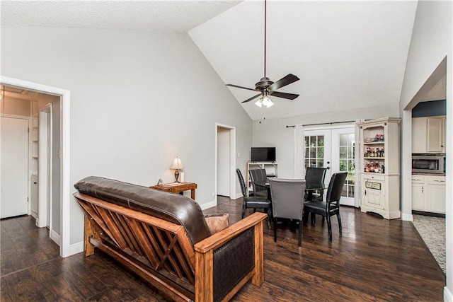 living room with dark wood-type flooring, ceiling fan, high vaulted ceiling, and french doors