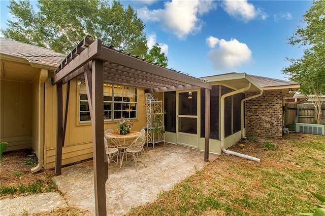 back of house with a patio and a sunroom