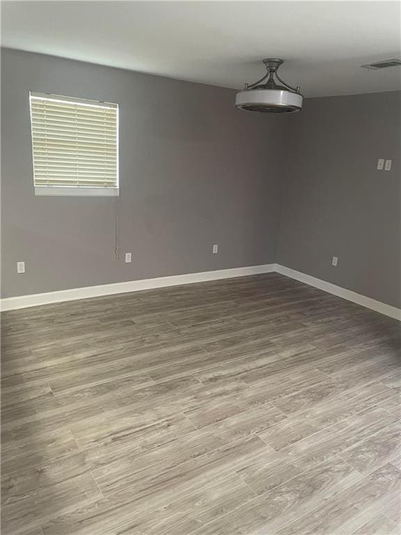 empty room with light hardwood / wood-style floors