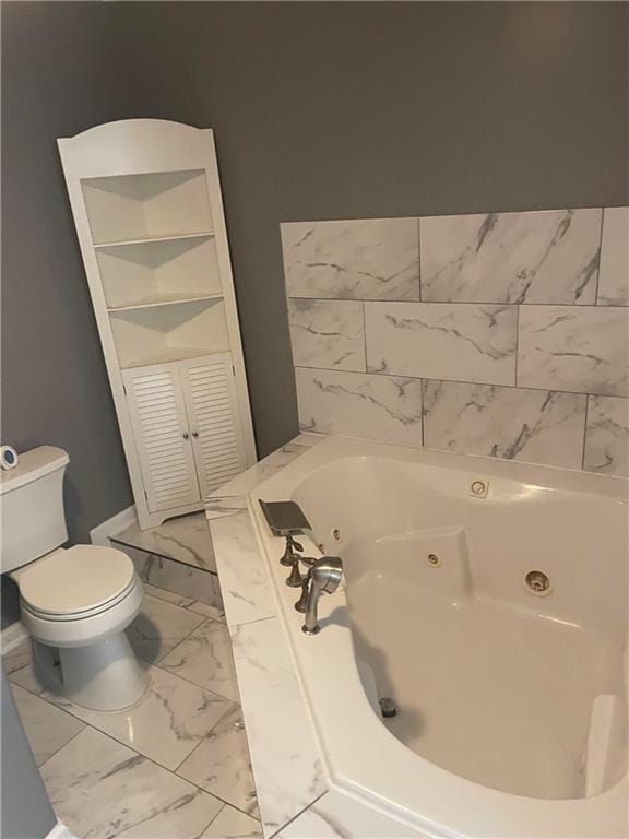 bathroom with toilet, tile patterned floors, and a washtub