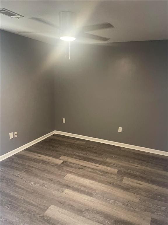 unfurnished room with hardwood / wood-style floors and ceiling fan