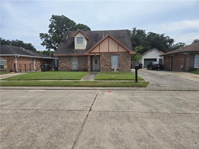 view of front of home featuring a front lawn and a garage