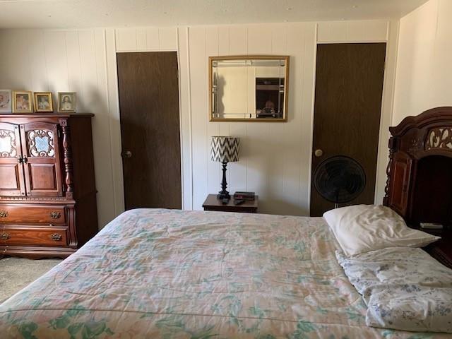 carpeted bedroom with a closet