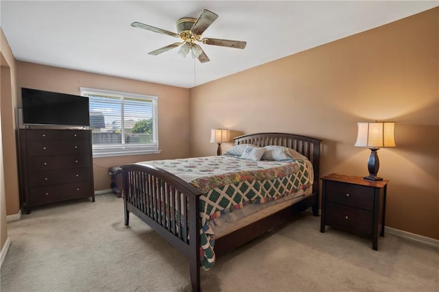 bedroom with light carpet and ceiling fan