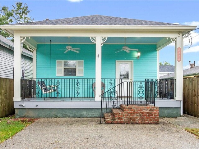 exterior space featuring a porch and ceiling fan