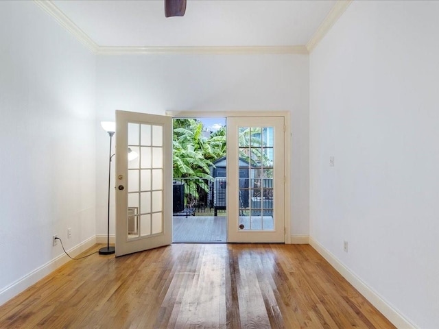 doorway with light wood-type flooring, french doors, crown molding, and ceiling fan