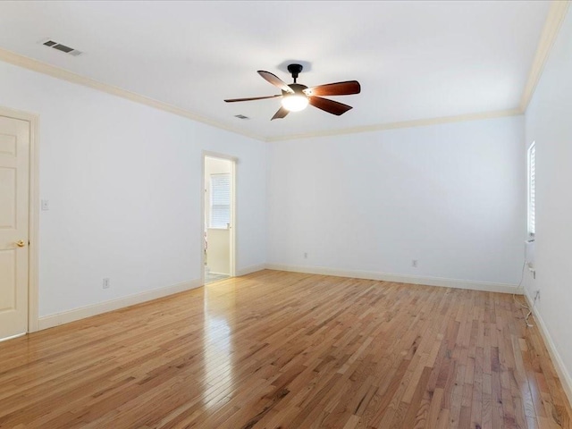 spare room featuring ornamental molding, light hardwood / wood-style flooring, and ceiling fan