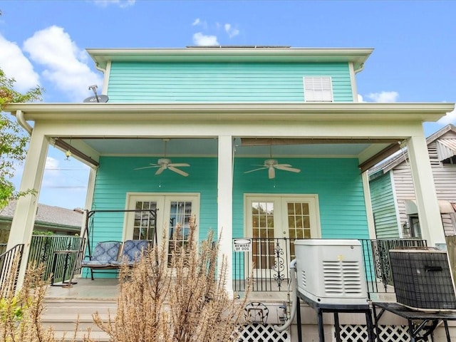 exterior space with covered porch, ceiling fan, and central AC