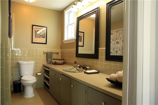 bathroom featuring tile walls, tile patterned flooring, vanity, and toilet