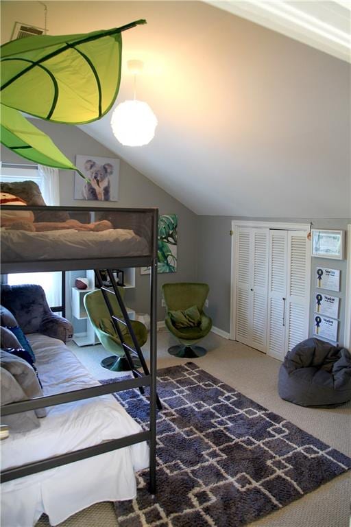 carpeted living room with vaulted ceiling