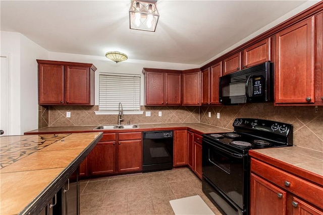 kitchen with tile countertops, sink, black appliances, light tile patterned floors, and tasteful backsplash