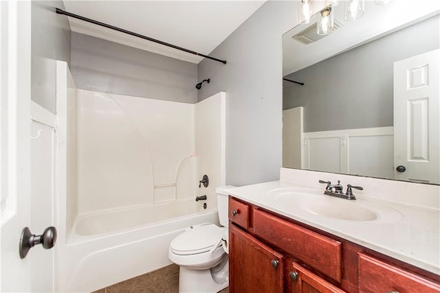 full bathroom featuring vanity, toilet,  shower combination, and tile patterned flooring