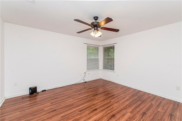 spare room with wood-type flooring and ceiling fan