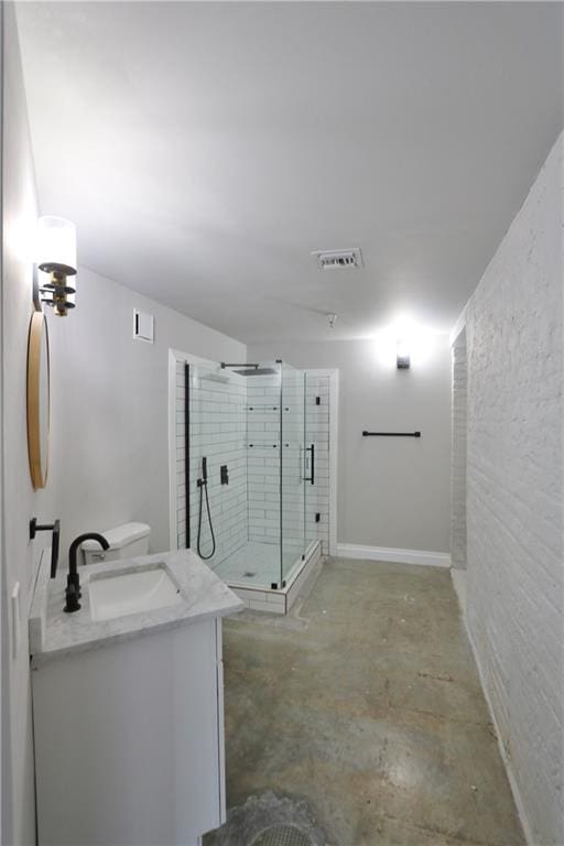 bathroom featuring a shower with shower door, concrete floors, and vanity