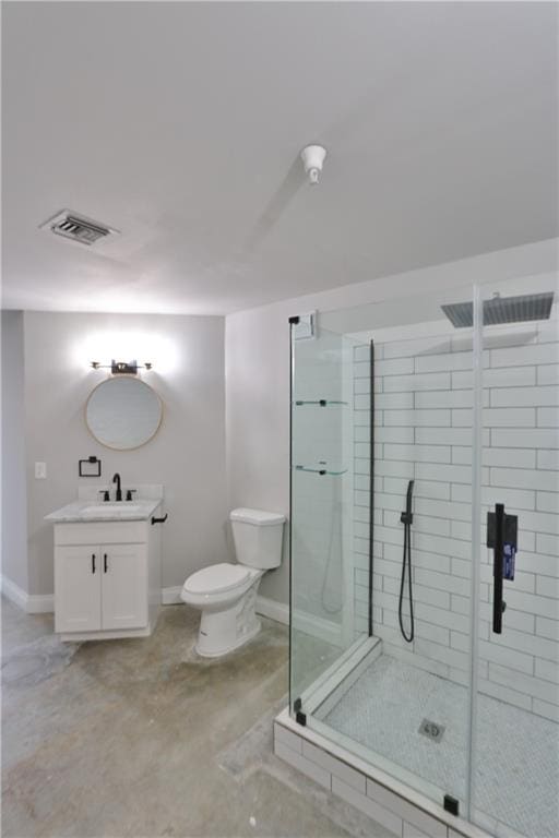 bathroom with an enclosed shower, toilet, concrete floors, and vanity