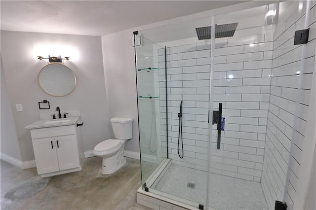 bathroom with vanity, toilet, concrete flooring, and a shower with door