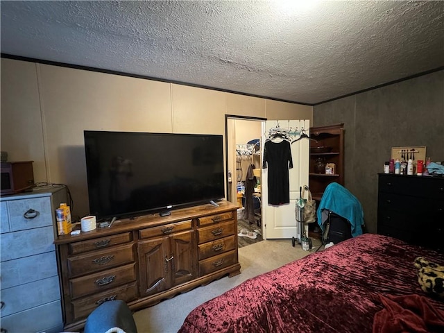 carpeted bedroom with a closet and a textured ceiling