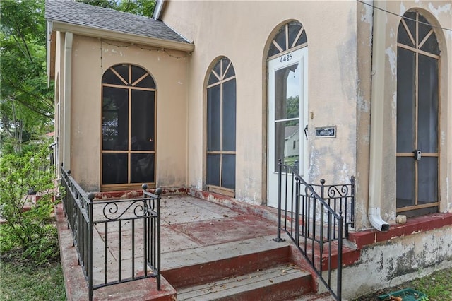 442527 Music St, New Orleans, LA 70122 - doorway to property with roof with shingles and stucco siding