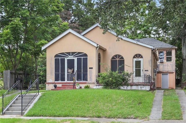 view of front of home with a front yard