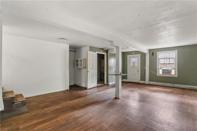 interior space with cooling unit and dark wood-type flooring