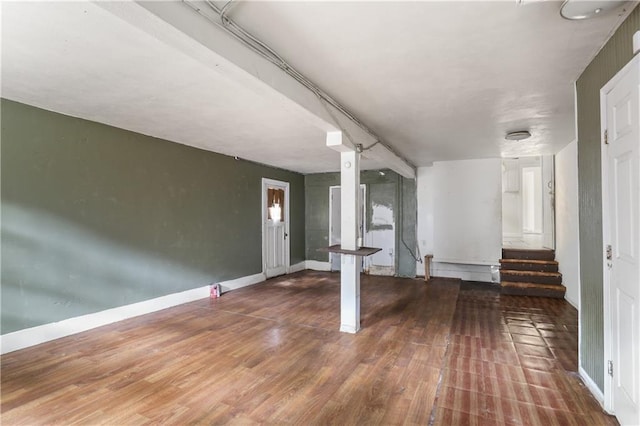 basement with hardwood / wood-style flooring