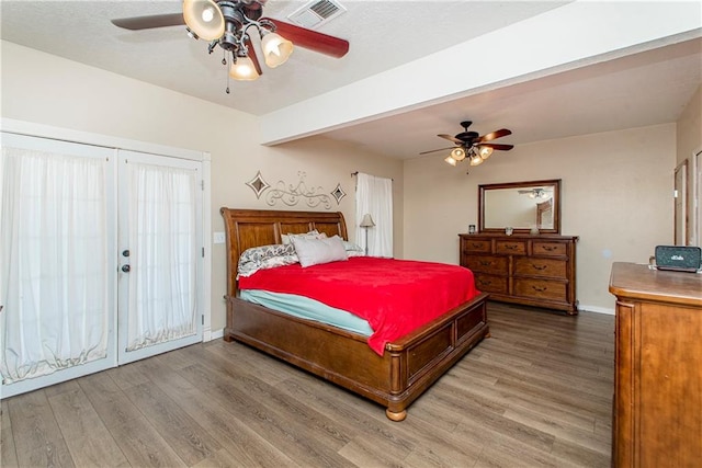 bedroom featuring ceiling fan and hardwood / wood-style flooring