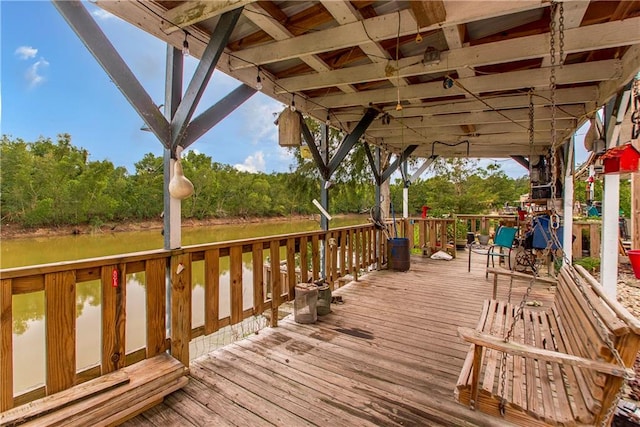 wooden deck with a water view