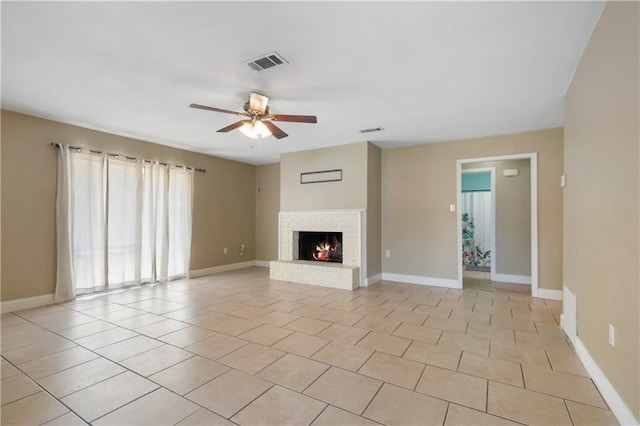 unfurnished living room with ceiling fan and light tile patterned floors