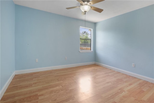 unfurnished room with light wood-type flooring and ceiling fan