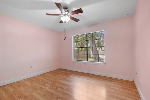 unfurnished room featuring ceiling fan and light hardwood / wood-style floors