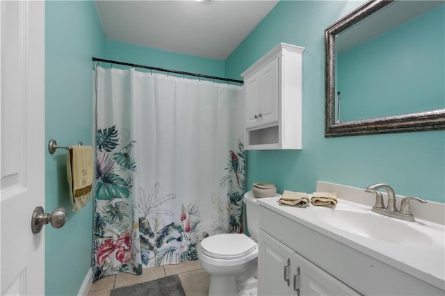 bathroom featuring vanity, toilet, a shower with shower curtain, and tile patterned flooring