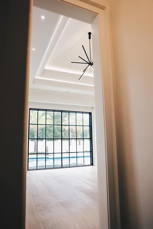 interior space with a wealth of natural light and hardwood / wood-style flooring