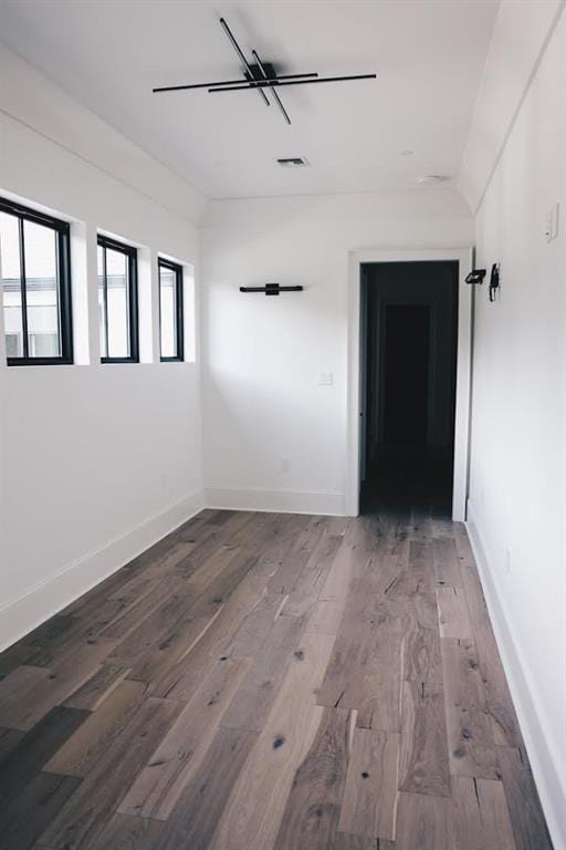 spare room featuring wood-type flooring