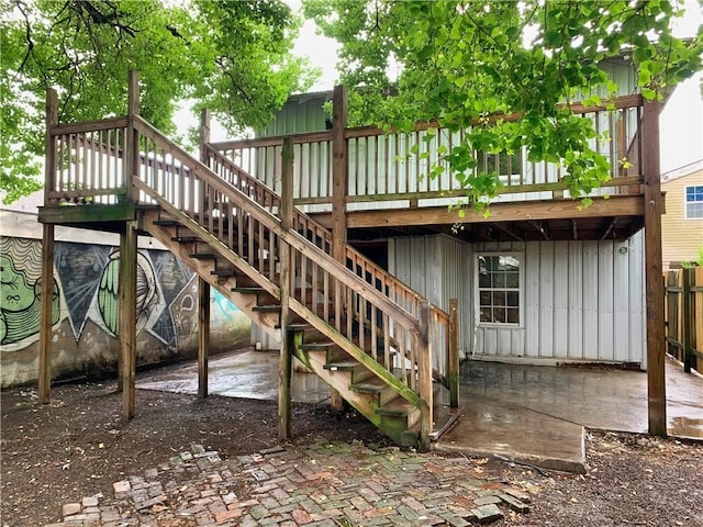 view of playground with a wooden deck