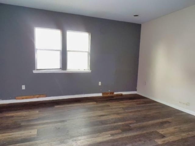 empty room featuring hardwood / wood-style floors