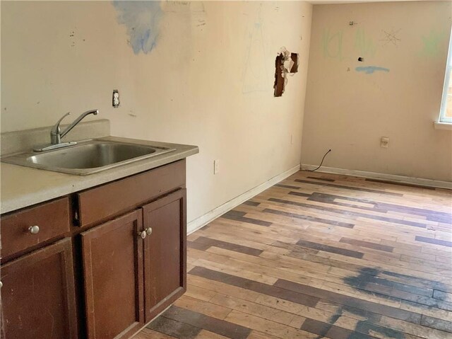 kitchen with wood-type flooring and sink