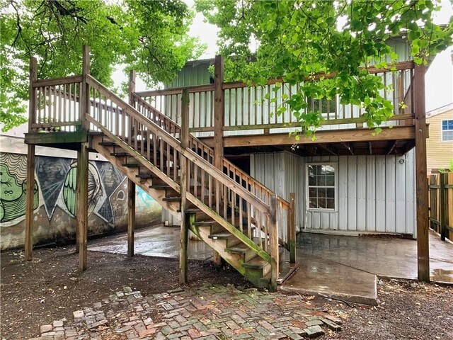 view of playground featuring a wooden deck