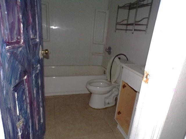 full bathroom with tile patterned flooring, vanity, toilet, and shower / bathtub combination