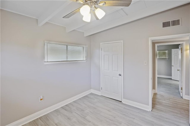 unfurnished bedroom featuring vaulted ceiling with beams, ceiling fan, and light hardwood / wood-style flooring