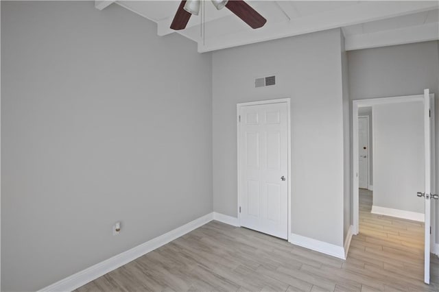 unfurnished bedroom with high vaulted ceiling, light hardwood / wood-style floors, and ceiling fan