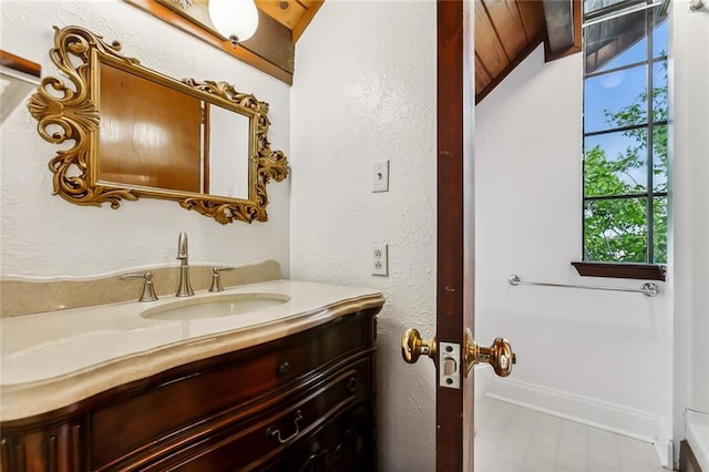 bathroom featuring lofted ceiling, vanity, and wooden ceiling