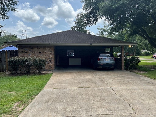 exterior space with a front lawn and a carport