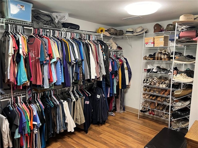 walk in closet featuring hardwood / wood-style floors