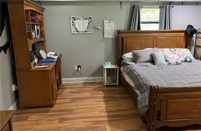 bedroom featuring hardwood / wood-style floors