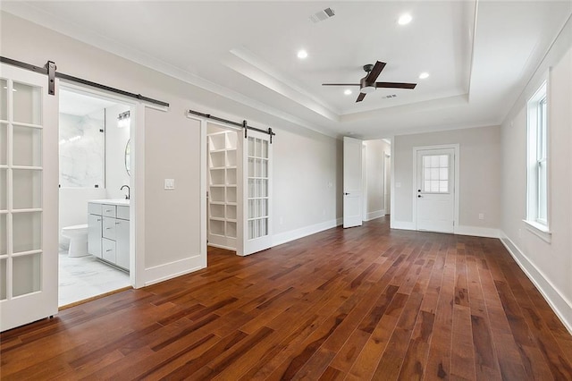 bathroom featuring vanity, toilet, and a tile shower