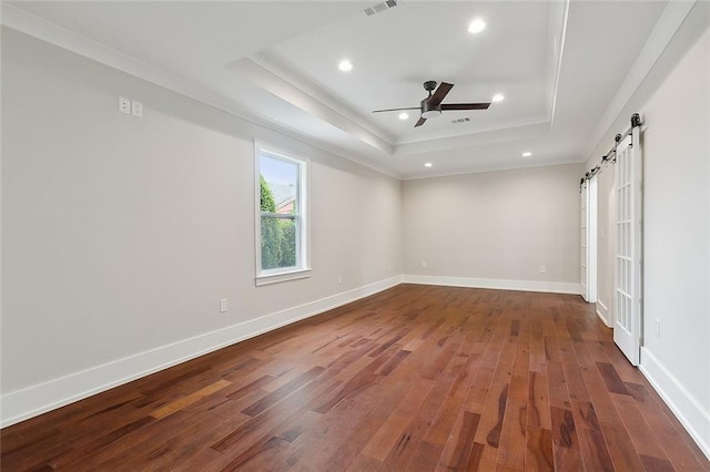 spare room featuring ceiling fan, ornamental molding, and wood-type flooring