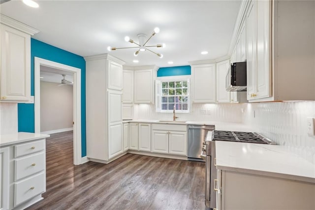 kitchen featuring hardwood / wood-style floors, dishwasher, and white cabinetry