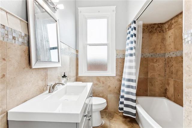 full bathroom featuring plenty of natural light, vanity, toilet, and shower / tub combo